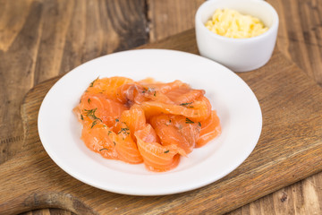 plate with salmon and butter