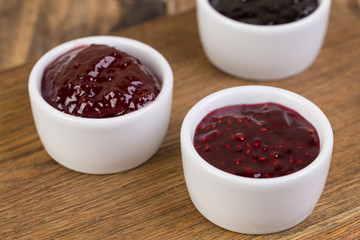 set of small bowls with berry jam