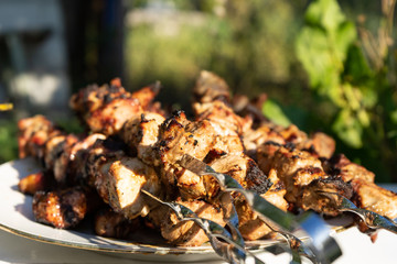 Barbecue on the grill. Ready-made pieces of meat on skewers.