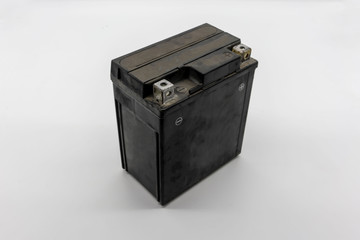 Used motorcycle black battery isolated on white
