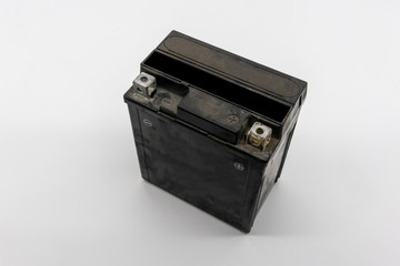 Used motorcycle black battery isolated on white