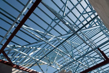 Naklejka premium Structure of steel roof frame for building construction.