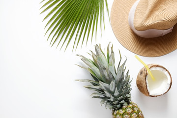 Summer mood concept. Tropical background with ripe organic pinapple with leafy crown, cracked...