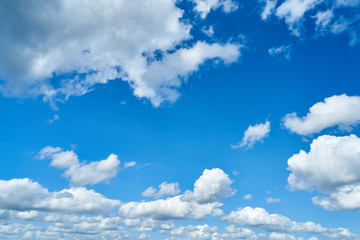 Blue sky with white clouds as a background