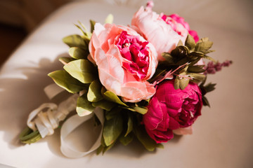 Bouquet of beautiful red artificial peonies.Horizontal photo
