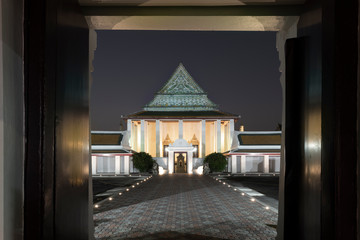 Cityscape, Buddhist temple photography, photo of Wat Thepthidaram, Bangkok, Thailand from the front entrance at night time.