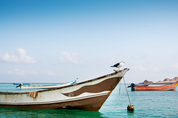 Simple fishing boats on the water of the Arabian Sea.