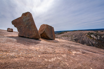 Giant granite rock boulders at Enchanted Rock State Natural Area, near Fredericksburg, Texas Hill Country, scenic granite dome, landmark