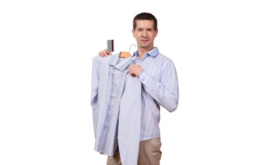 the man holds a coat hanger with a shirt and the plastic card on a white background