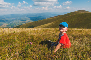 Naklejka na ściany i meble little kid on the top of mount with beautiful view