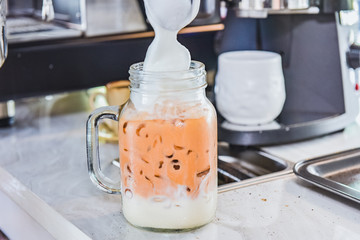 Ice thai tea with milk, traditional Indian drink is iced tea or chai masala, Milk tea, Orange tea