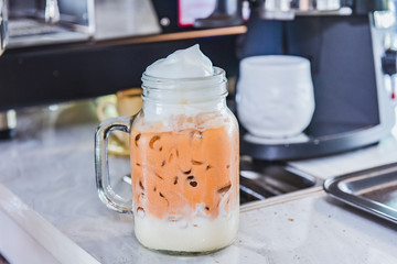 Ice thai tea with milk, traditional Indian drink is iced tea or chai masala, Milk tea, Orange tea