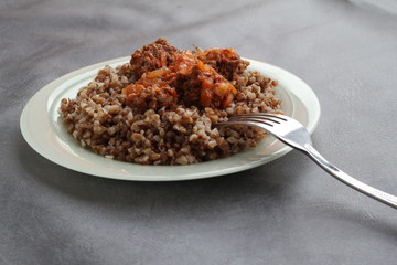 Buckwheat with sauce and meat.