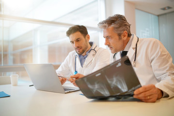 Doctors going over patient's results in hospital