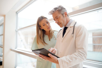 Nurse and doctor going over patient's results in hospital