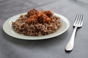 Buckwheat with sauce and meat.