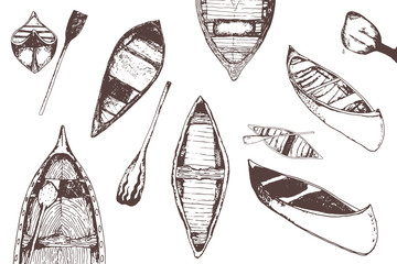 hand drawn traced collection of monochrome canoes isolated on white.
