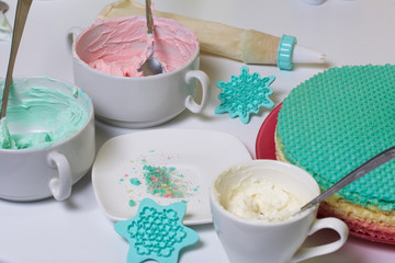 Cream of different colors for decorating waffle cake. Round wafer cakes of different colors. For making waffle cake.