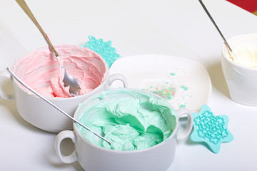 Cream of different colors for decorating waffle cake.