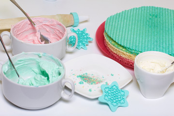 Cream of different colors for decorating waffle cake. Round wafer cakes of different colors. For making waffle cake.