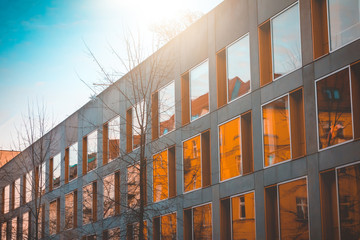 futuristic apartment complex with big windows and concrete facade