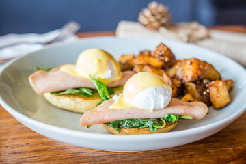 Organic Egg Benedict Poached egg, smoked turkey ham, baby spinach, creamy hollandaise sauce, fluffy brioche bun and spicy roasted potato.