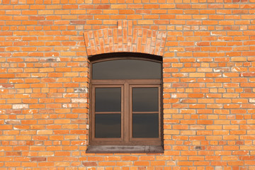 Fototapeta na wymiar window in the center of a brick wall