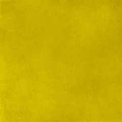 Abstract vibrant yellow stucco wall texture surface background, colorful tile
