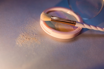 rainbow highlighter and cute twisted makeup brush close-up