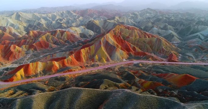 Aerial 4k drone footage of most colorful mountains on earth, the rainbow mountains of Zhangye Danxia National Geological Park. Shown is the most vibrant, multicolored part of this amazing landscape.