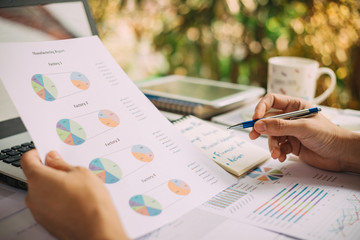 business woman working on project for analyzing company financial report balance statement with...