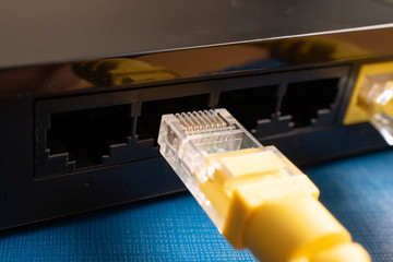 close-up patch cord yellow which is preparing to stand in the port