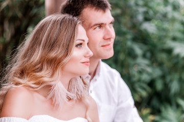 Fototapeta premium Bride and groom are looking somewhere. Horizontal photo