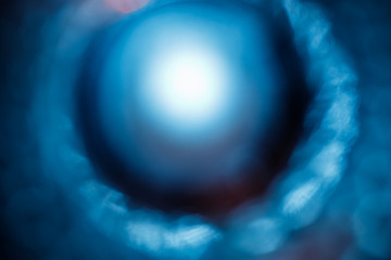 Lens Flare. Light over black background. Easy to add overlay or screen filter over photos. Abstract sun burst with digital lens flare background. Gleams rounded and hexagonal shapes, rainbow halo.