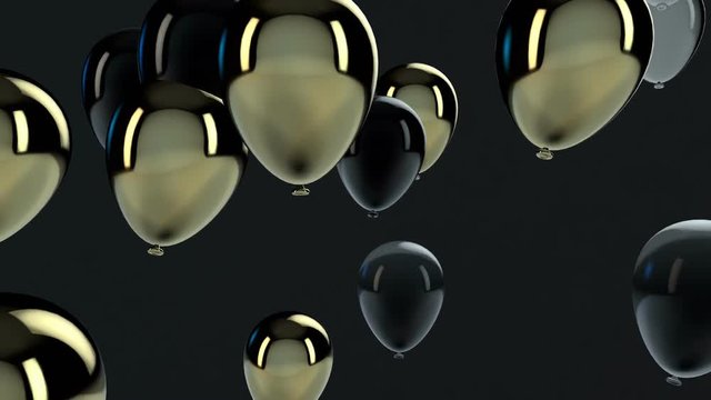 Black and Gold balloon floating in the air