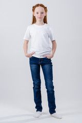  Young caucasian, european woman, girl in white t-shirt. Girl posing in a white T-shirt. Girl in white t-shirt. T-shirt with copy space.