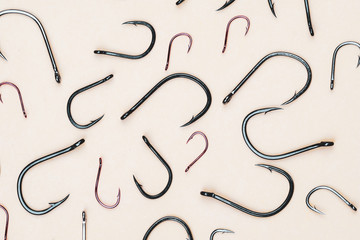 top view of fishing hooks of different shape color and size