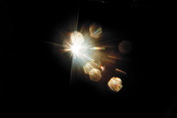 Lens Flare. Light over black background. Easy to add overlay or screen filter over photos. Abstract...