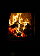 firewood burning in the stove