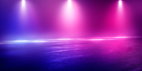 Background of the room with concrete pavement. Blue and pink neon light. Smoke, fog, wet asphalt with reflection of lights. Abstract light, searchlight rays. Night view of the street with lights, dark