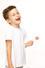 little boy with a lollipop on a white background 