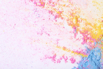 Colorful holi powders on white background