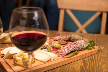 Cheese, sausages and red wine as an appetizer