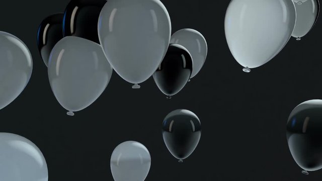 White and Black balloon floating in the air