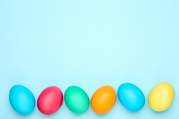 Colorful easter eggs on blue background