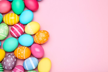 Fototapeta na wymiar Colorful easter eggs on pink background