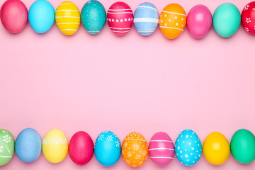 Colorful easter eggs on pink background