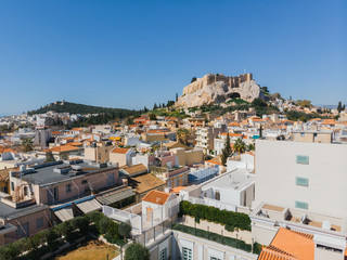 City views of day time with acropolis on a hill at the horizon, Athens, Greece