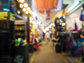 Fototapeta premium Blurred group of tourist people shopping in souvenir shop