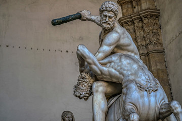 Statue of Hercules killing the Centaur, made by sculptor Giambologna. Loggia dei Lanzi at the Piazza della Signoria in Firenze, Italy - obrazy, fototapety, plakaty